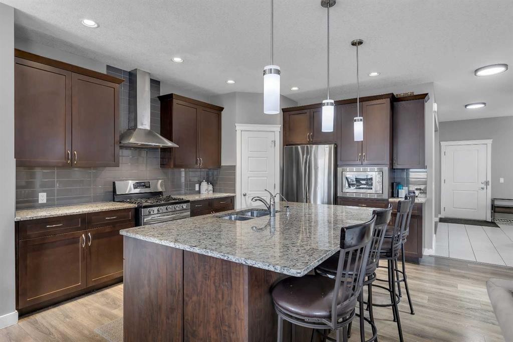 225 Cornerstone Manor Ne, Calgary, AB - Indoor Photo Showing Kitchen With Stainless Steel Kitchen With Double Sink With Upgraded Kitchen
