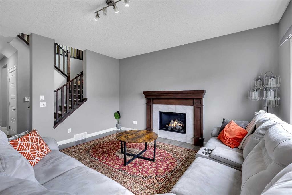 225 Cornerstone Manor Ne, Calgary, AB - Indoor Photo Showing Living Room With Fireplace