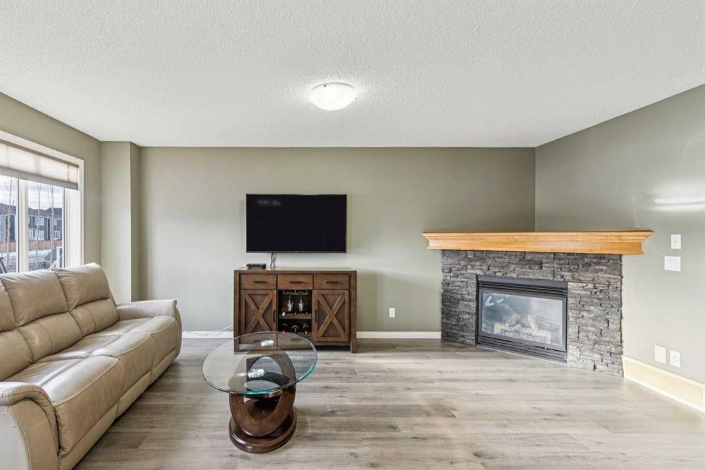 460 Silverado Plains Circle Sw, Calgary, AB - Indoor Photo Showing Living Room With Fireplace