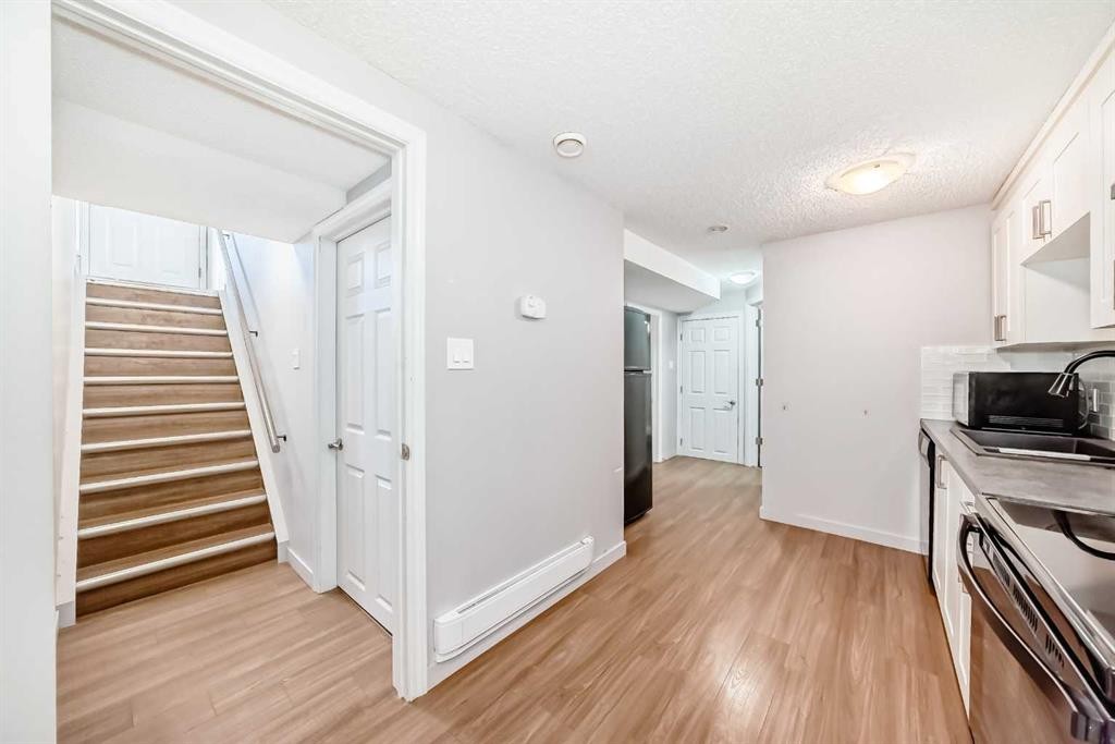 611 Meota Road Ne, Calgary, AB - Indoor Photo Showing Kitchen With Double Sink