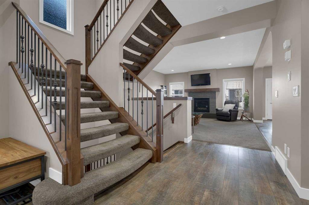 300 Aspenmere Way, Chestermere, AB - Indoor Photo Showing Other Room With Fireplace
