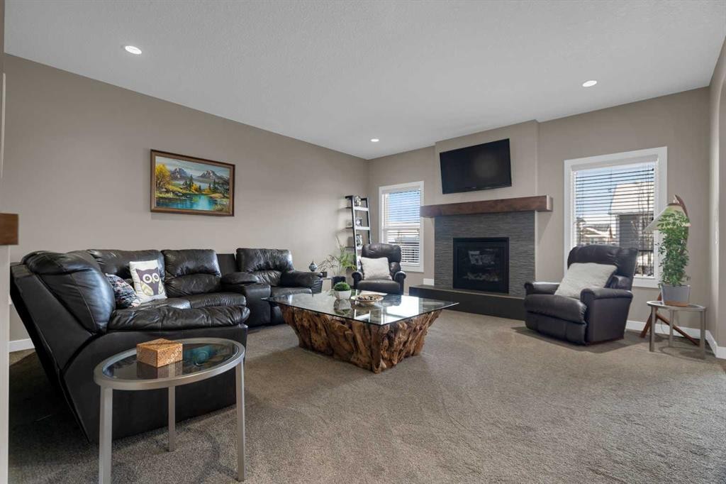 300 Aspenmere Way, Chestermere, AB - Indoor Photo Showing Living Room With Fireplace