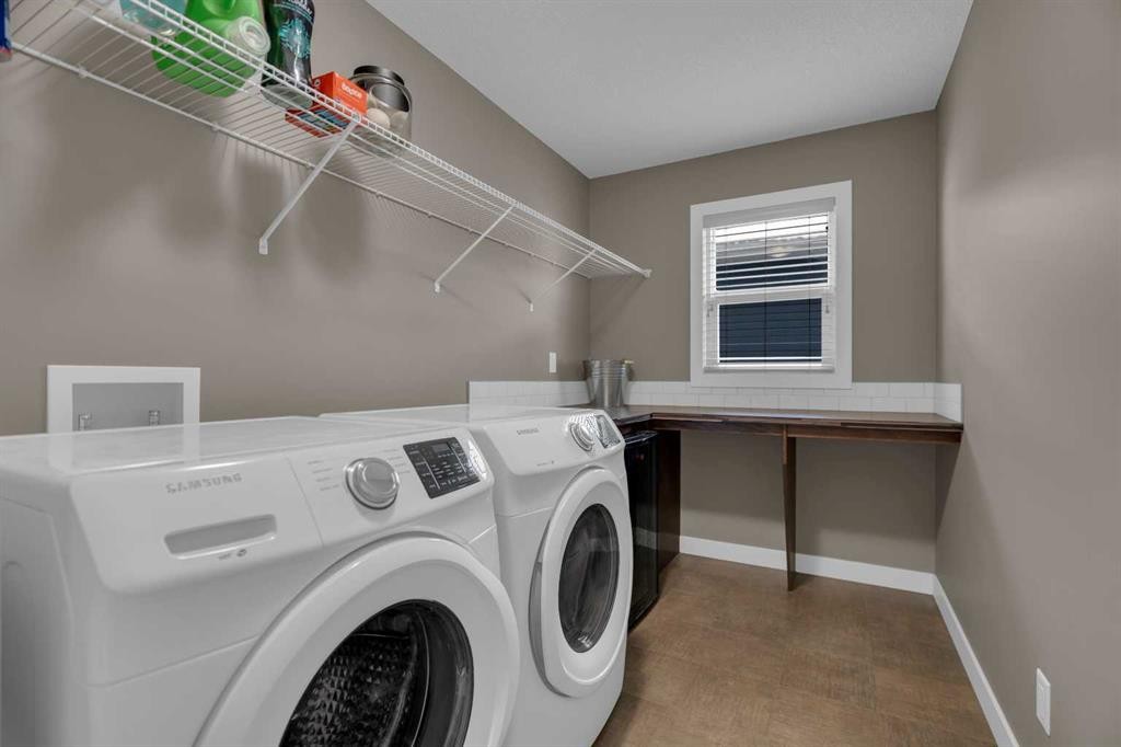 300 Aspenmere Way, Chestermere, AB - Indoor Photo Showing Laundry Room