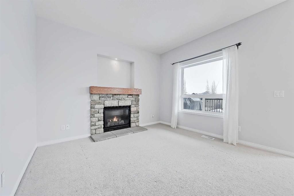102 Kincora Glen Mews Nw, Calgary, AB - Indoor Photo Showing Living Room With Fireplace