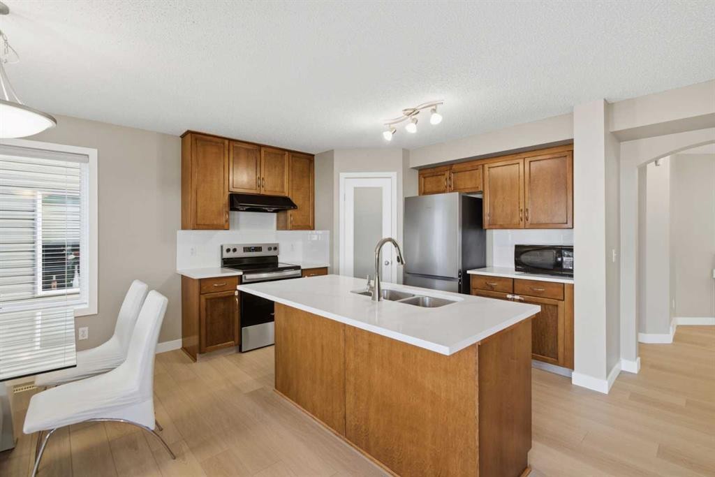 227 Panamount Circle Nw, Calgary, AB - Indoor Photo Showing Kitchen With Double Sink