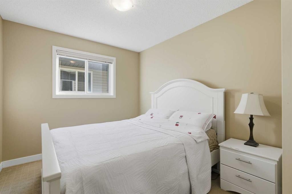 227 Panamount Circle Nw, Calgary, AB - Indoor Photo Showing Bedroom
