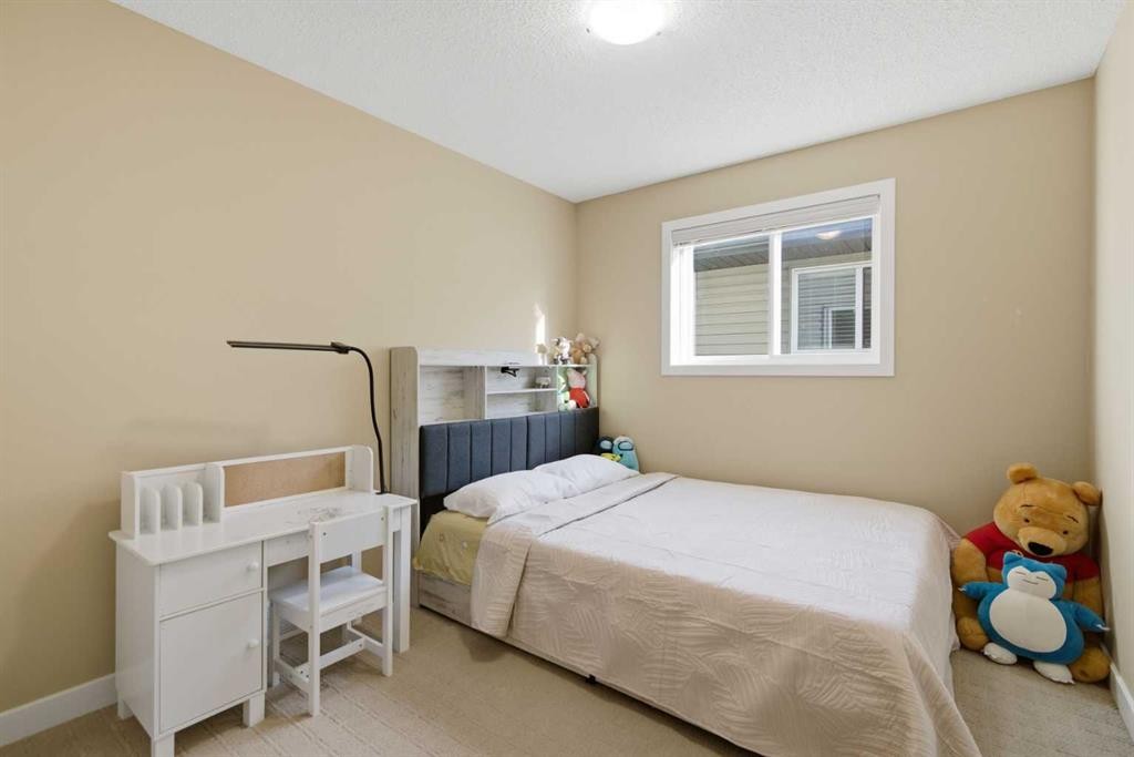 227 Panamount Circle Nw, Calgary, AB - Indoor Photo Showing Bedroom