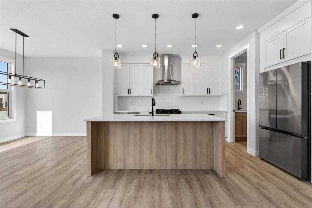 298 Kinniburgh Loop, Chestermere, AB - Indoor Photo Showing Kitchen With Upgraded Kitchen