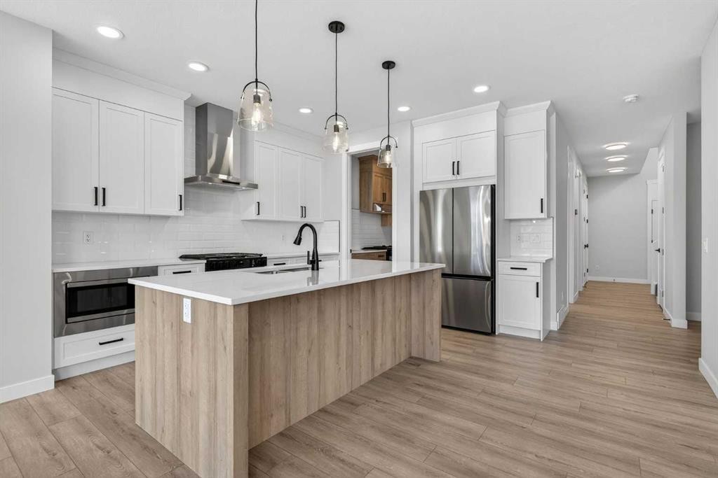 298 Kinniburgh Loop, Chestermere, AB - Indoor Photo Showing Kitchen With Stainless Steel Kitchen With Upgraded Kitchen