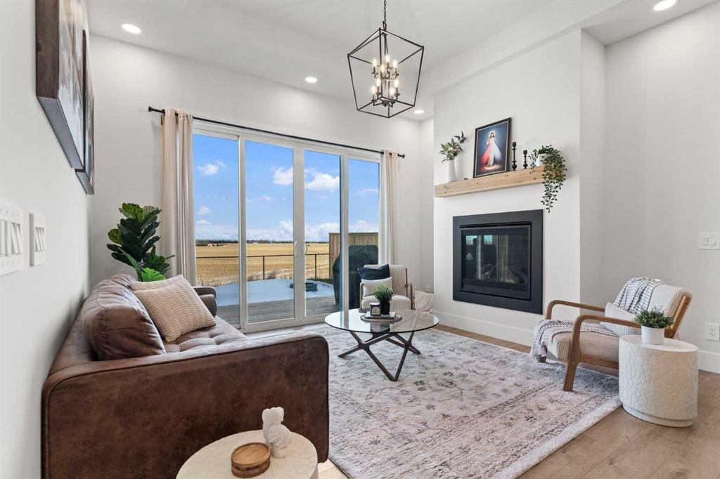 79 Sandpiper Bend, Chestermere, AB - Indoor Photo Showing Living Room With Fireplace