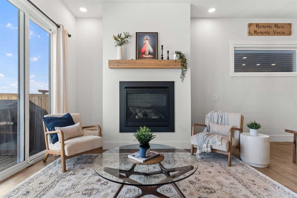 79 Sandpiper Bend, Chestermere, AB - Indoor Photo Showing Living Room With Fireplace