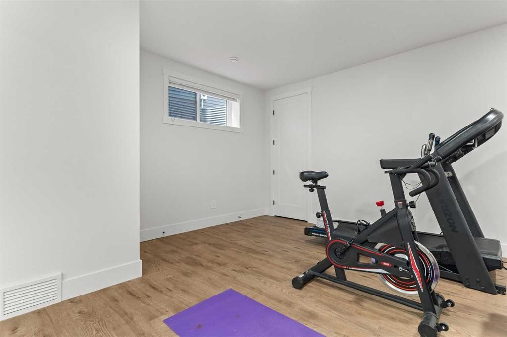 79 Sandpiper Bend, Chestermere, AB - Indoor Photo Showing Gym Room