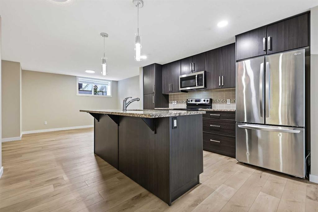 147 Mckenzie Towne Close Se, Calgary, AB - Indoor Photo Showing Kitchen With Stainless Steel Kitchen With Upgraded Kitchen