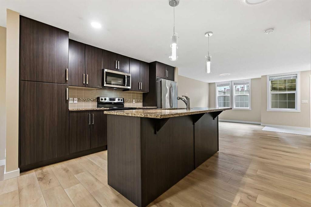 147 Mckenzie Towne Close Se, Calgary, AB - Indoor Photo Showing Kitchen With Stainless Steel Kitchen With Upgraded Kitchen