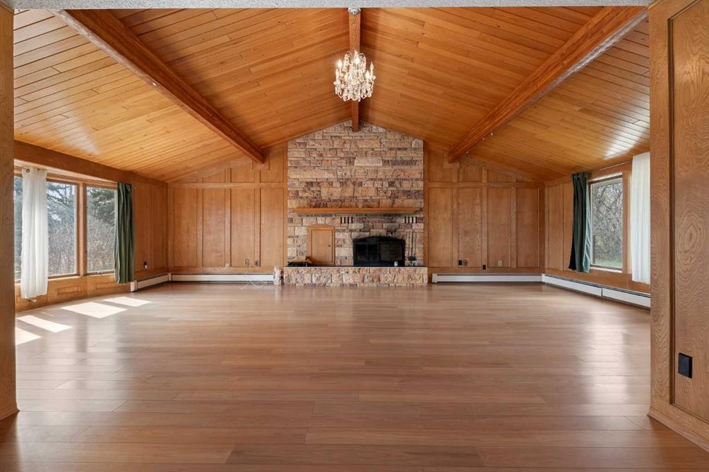 1008 Shawnee Drive Sw, Calgary, AB - Indoor Photo Showing Other Room With Fireplace