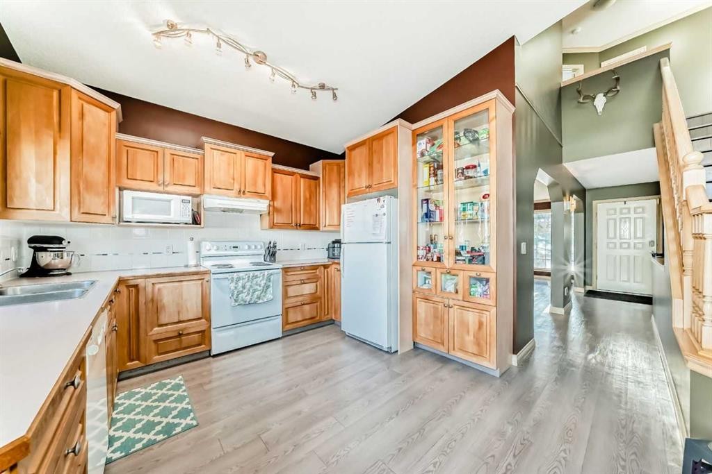 52 Douglas Ridge Close Se, Calgary, AB - Indoor Photo Showing Kitchen With Double Sink