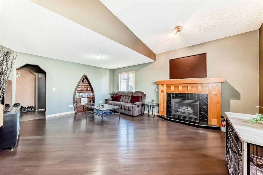 52 Douglas Ridge Close Se, Calgary, AB - Indoor Photo Showing Living Room With Fireplace