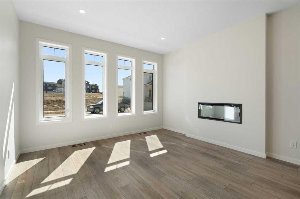 75 Bluerock Terrace Sw, Calgary, AB - Indoor With Fireplace
