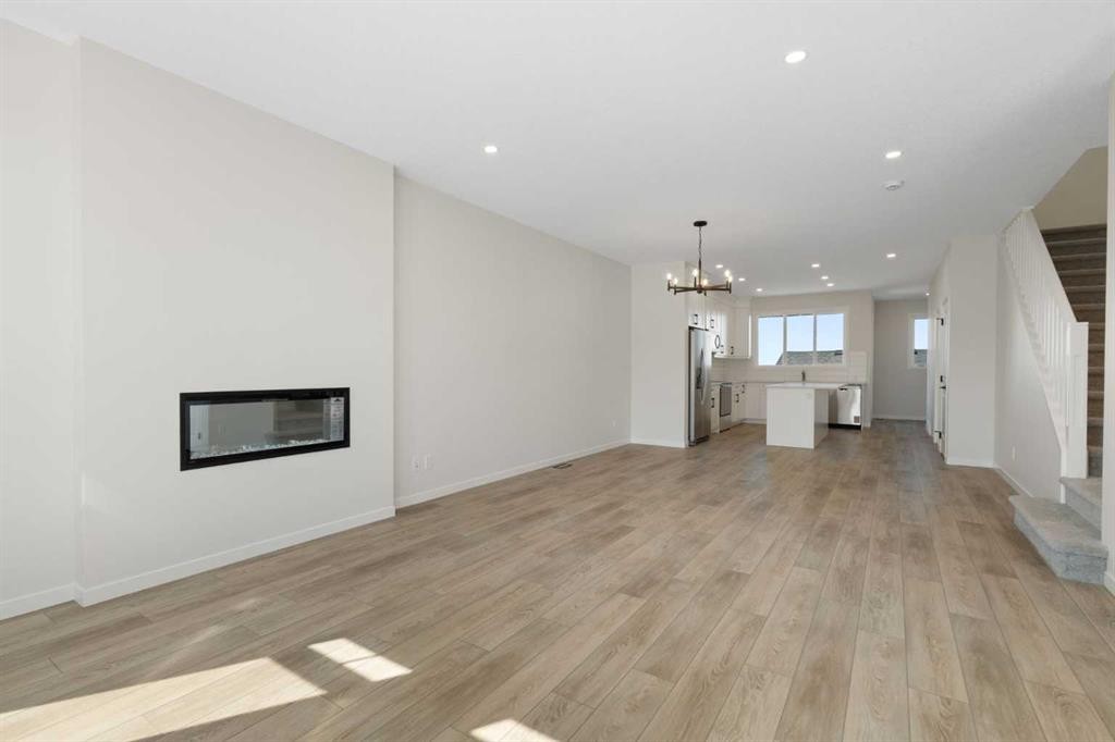 75 Bluerock Terrace Sw, Calgary, AB - Indoor Photo Showing Living Room With Fireplace