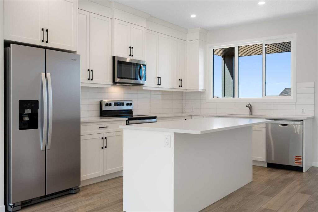 75 Bluerock Terrace Sw, Calgary, AB - Indoor Photo Showing Kitchen With Upgraded Kitchen