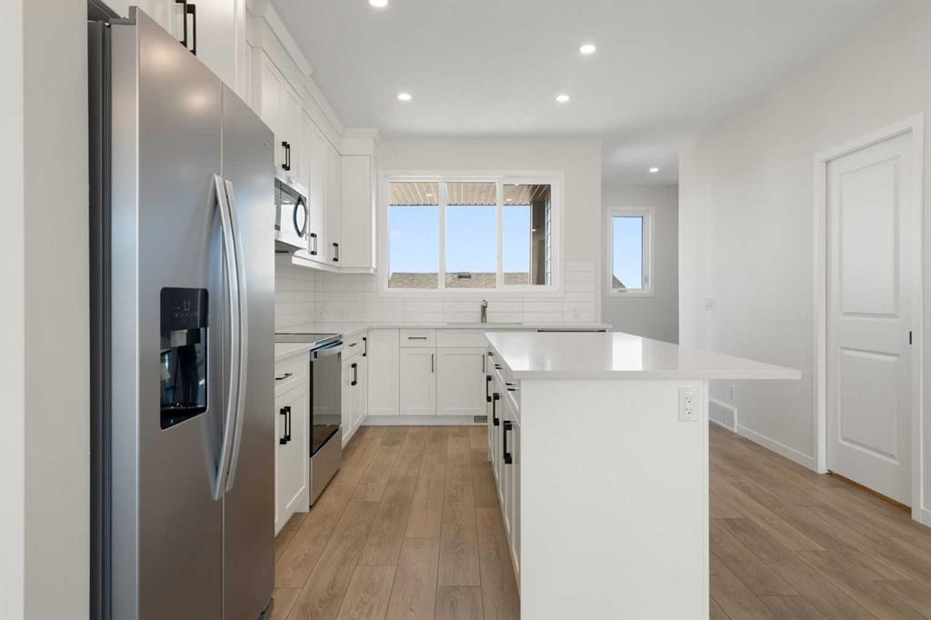 75 Bluerock Terrace Sw, Calgary, AB - Indoor Photo Showing Kitchen With Upgraded Kitchen