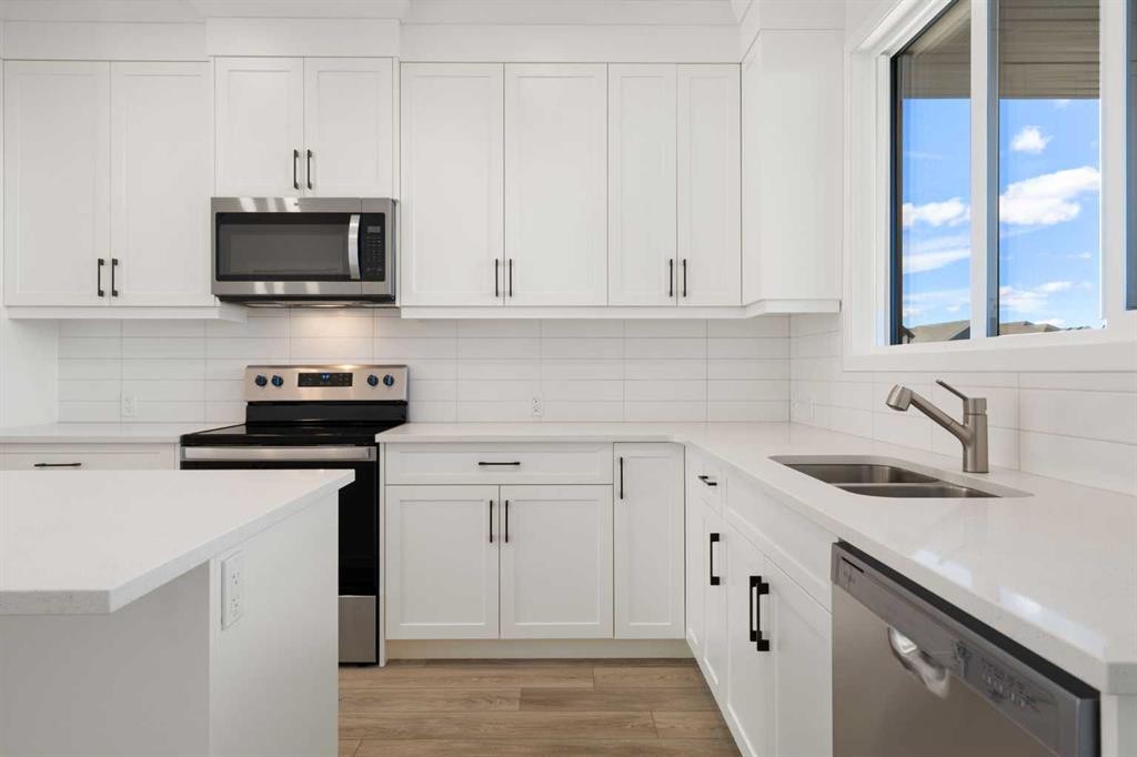 75 Bluerock Terrace Sw, Calgary, AB - Indoor Photo Showing Kitchen With Double Sink