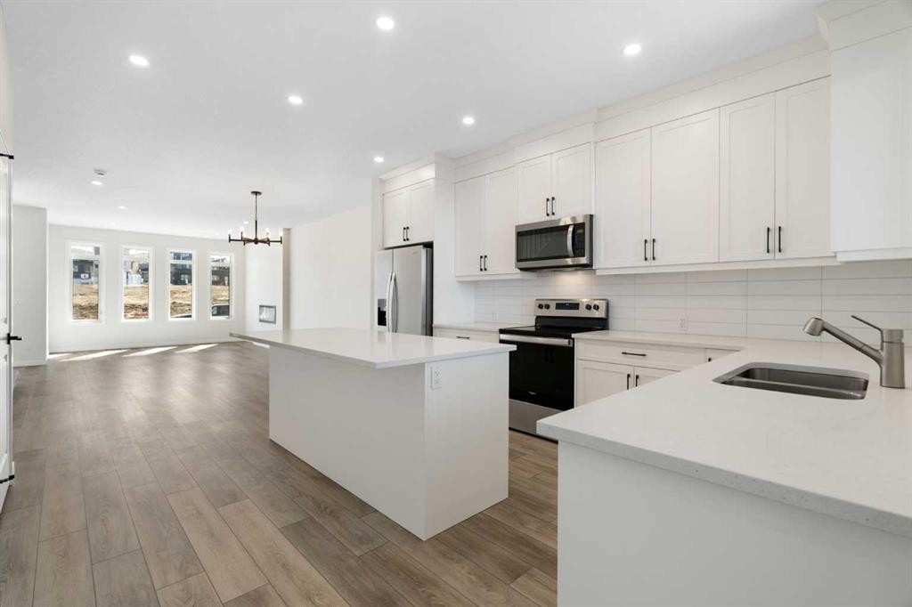 75 Bluerock Terrace Sw, Calgary, AB - Indoor Photo Showing Kitchen With Double Sink With Upgraded Kitchen