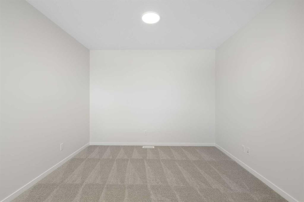 75 Bluerock Terrace Sw, Calgary, AB - Indoor Photo Showing Other Room