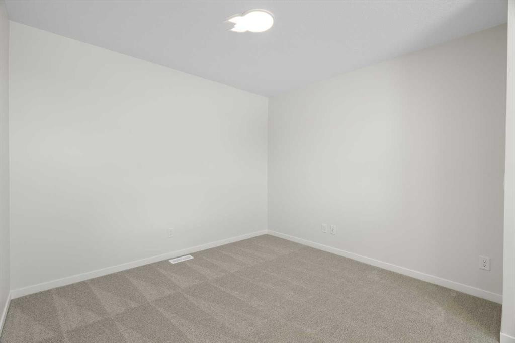75 Bluerock Terrace Sw, Calgary, AB - Indoor Photo Showing Other Room
