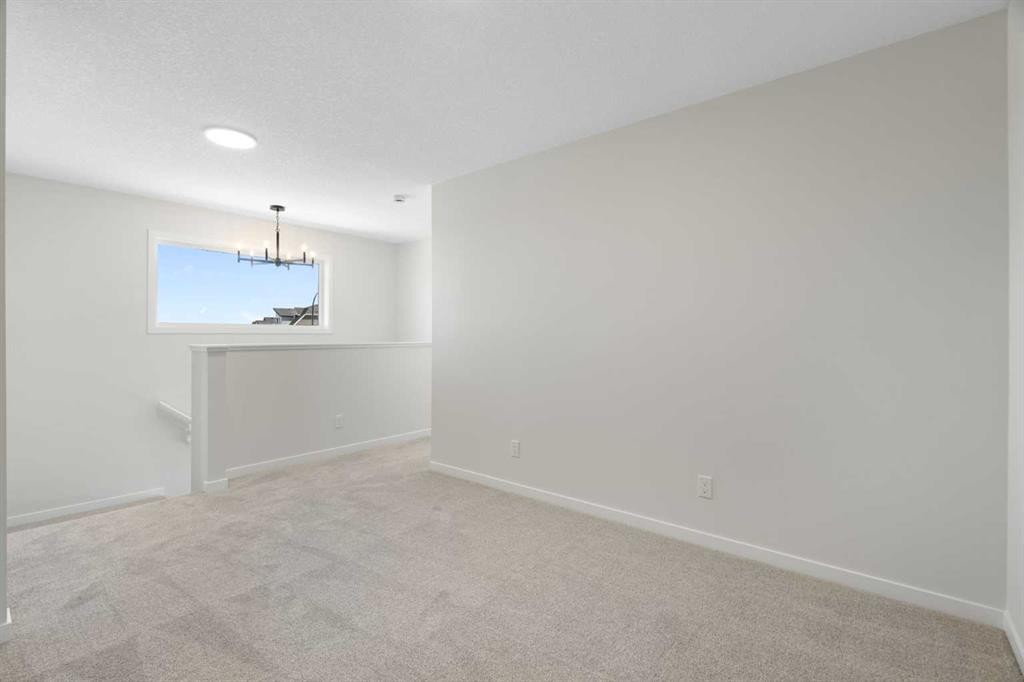75 Bluerock Terrace Sw, Calgary, AB - Indoor Photo Showing Other Room