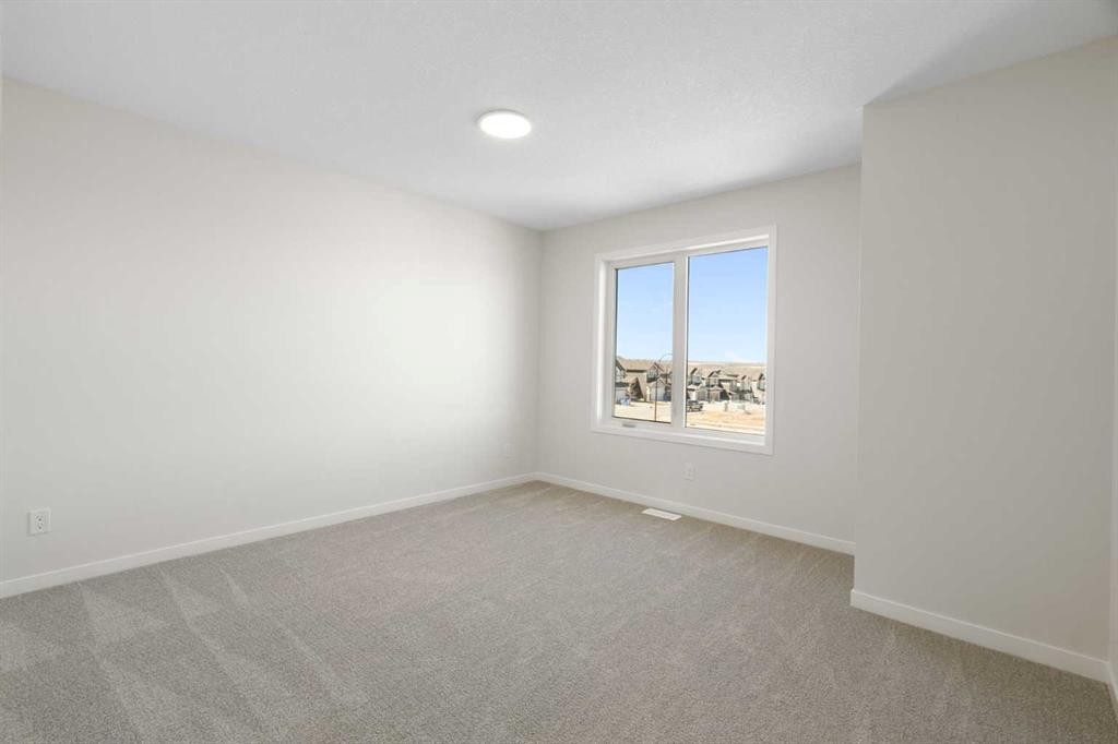 75 Bluerock Terrace Sw, Calgary, AB - Indoor Photo Showing Other Room