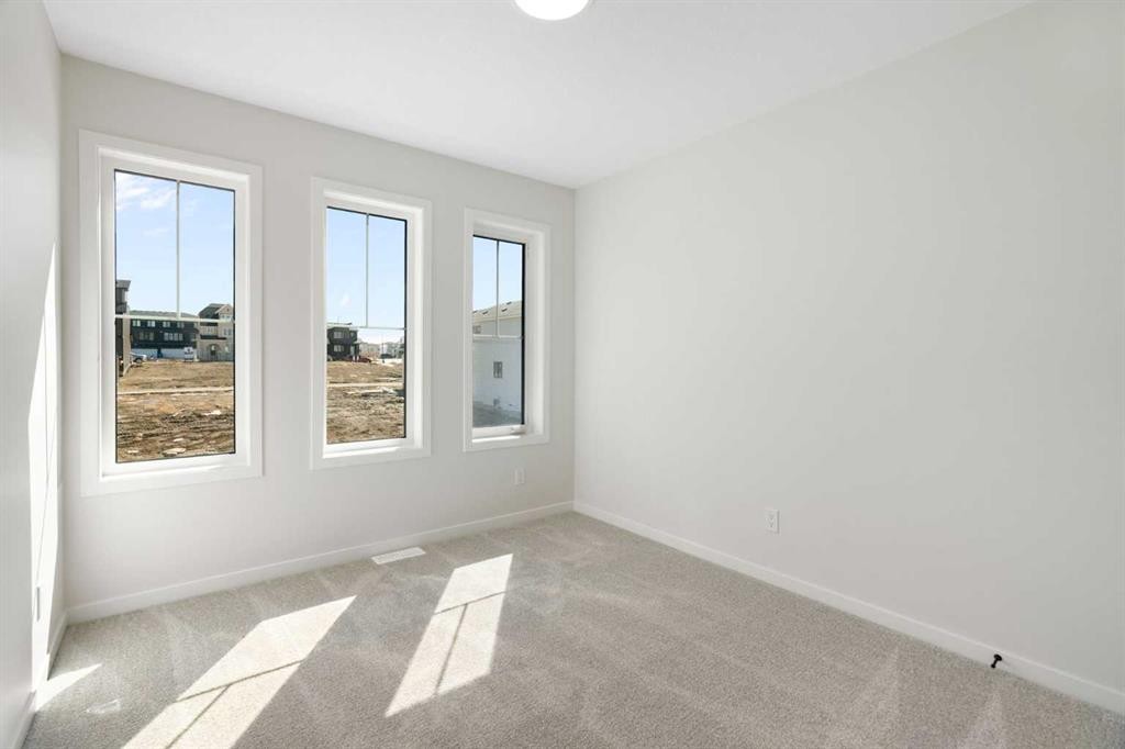 75 Bluerock Terrace Sw, Calgary, AB - Indoor Photo Showing Other Room
