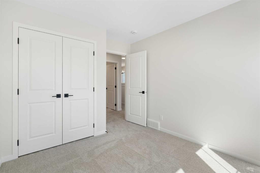 75 Bluerock Terrace Sw, Calgary, AB - Indoor Photo Showing Other Room