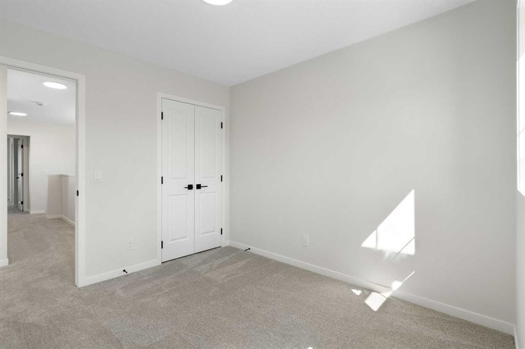 75 Bluerock Terrace Sw, Calgary, AB - Indoor Photo Showing Other Room