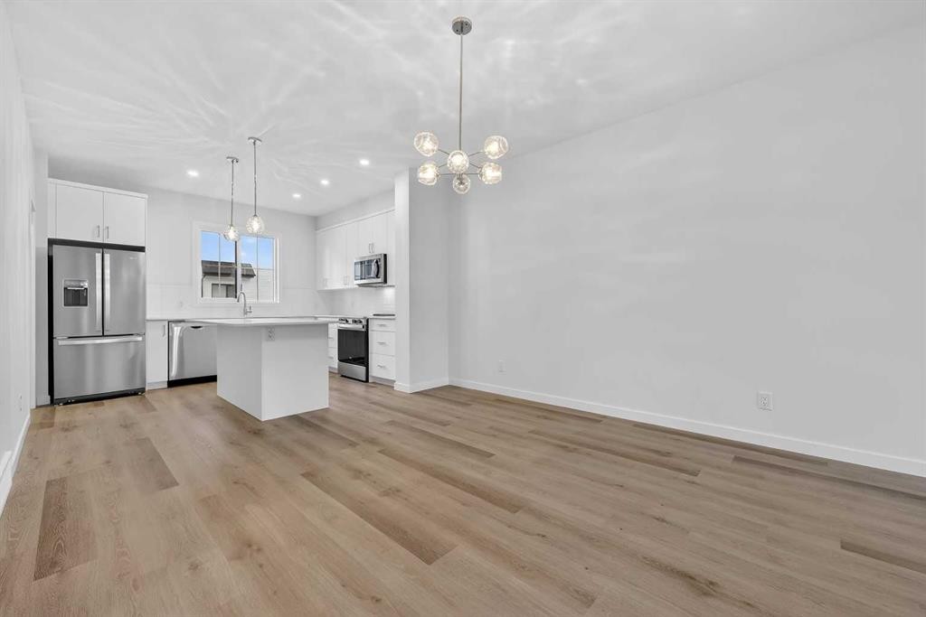 107-1750 Rangeview Drive Se, Calgary, AB - Indoor Photo Showing Kitchen With Stainless Steel Kitchen With Upgraded Kitchen