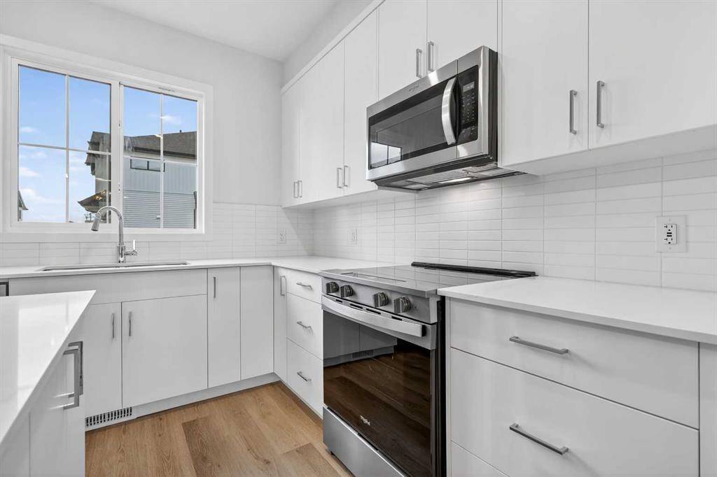 107-1750 Rangeview Drive Se, Calgary, AB - Indoor Photo Showing Kitchen With Upgraded Kitchen