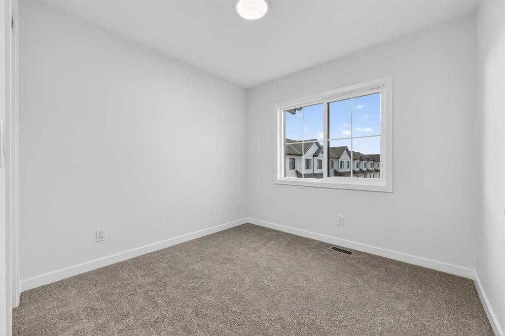 107-1750 Rangeview Drive Se, Calgary, AB - Indoor Photo Showing Other Room