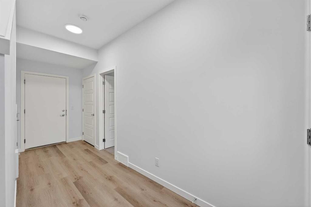 107-1750 Rangeview Drive Se, Calgary, AB - Indoor Photo Showing Other Room