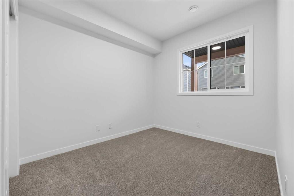 107-1750 Rangeview Drive Se, Calgary, AB - Indoor Photo Showing Other Room