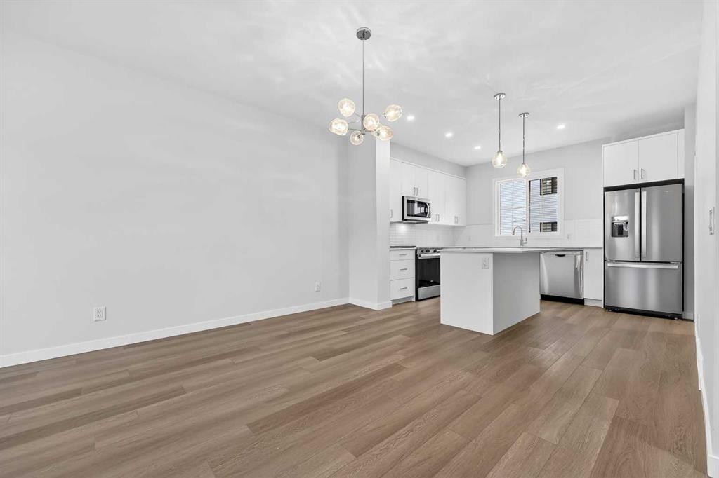 412-1750 Rangeview Drive Se, Calgary, AB - Indoor Photo Showing Kitchen With Stainless Steel Kitchen With Upgraded Kitchen