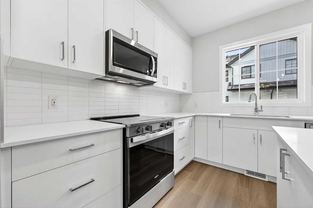 412-1750 Rangeview Drive Se, Calgary, AB - Indoor Photo Showing Kitchen With Upgraded Kitchen