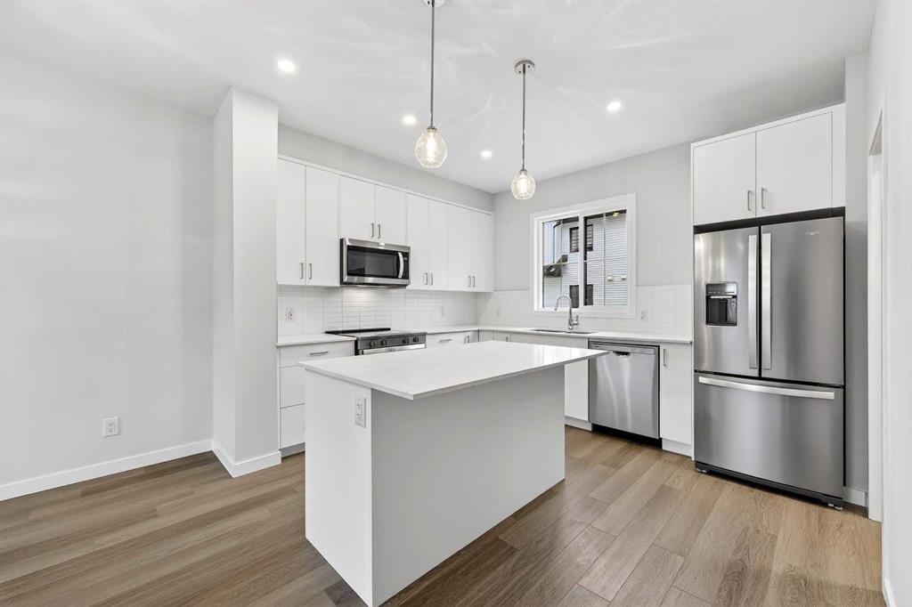412-1750 Rangeview Drive Se, Calgary, AB - Indoor Photo Showing Kitchen With Stainless Steel Kitchen With Upgraded Kitchen
