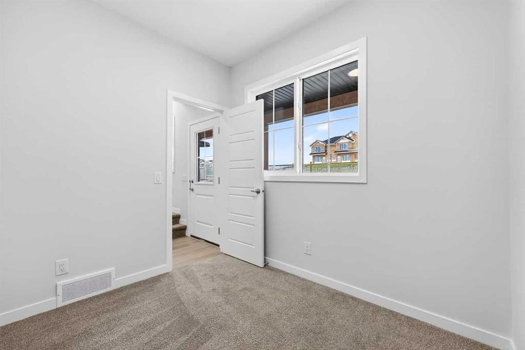 412-1750 Rangeview Drive Se, Calgary, AB - Indoor Photo Showing Other Room