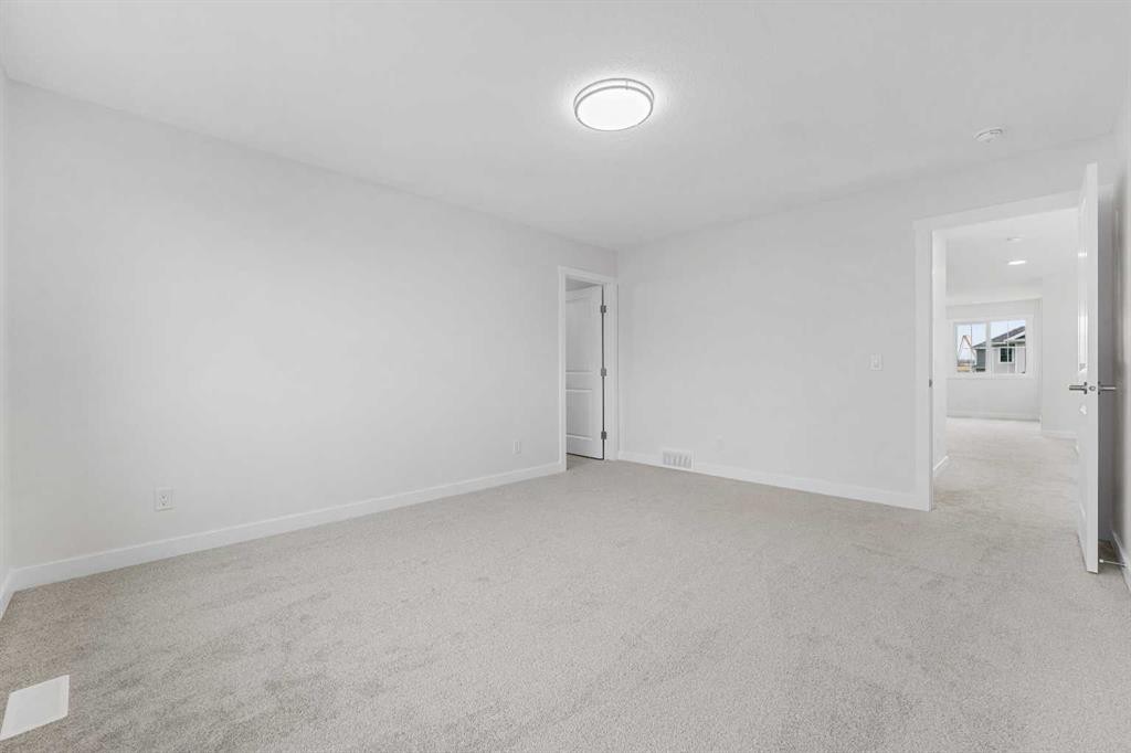 142 Sunstone Way, Balzac, AB - Indoor Photo Showing Other Room