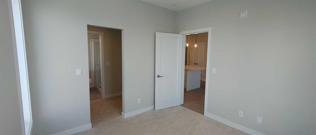 403-660 Shawnee Square Sw, Calgary, AB - Indoor Photo Showing Other Room