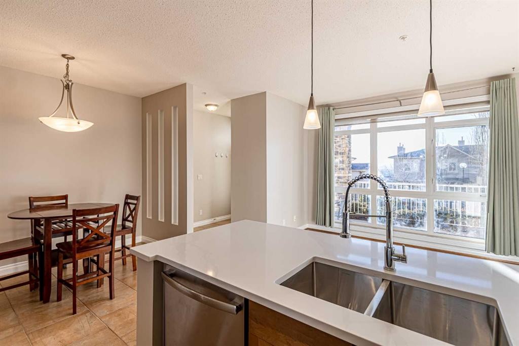 3-148 Rockyledge View Nw, Calgary, AB - Indoor Photo Showing Kitchen With Double Sink