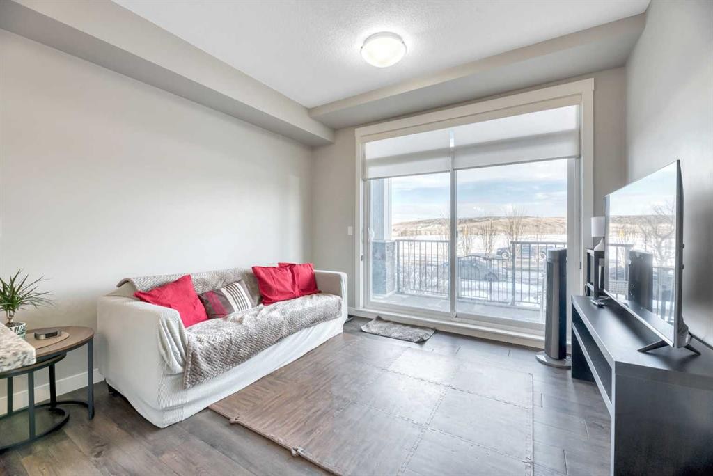 119-10 Walgrove Walk Se, Calgary, AB - Indoor Photo Showing Living Room