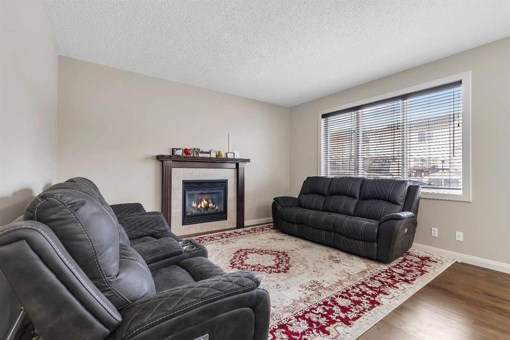 1564 Copperfield Boulevard Se, Calgary, AB - Indoor Photo Showing Living Room With Fireplace