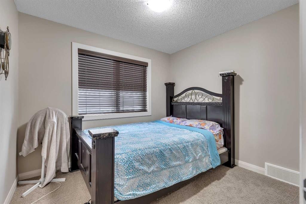 1564 Copperfield Boulevard Se, Calgary, AB - Indoor Photo Showing Bedroom