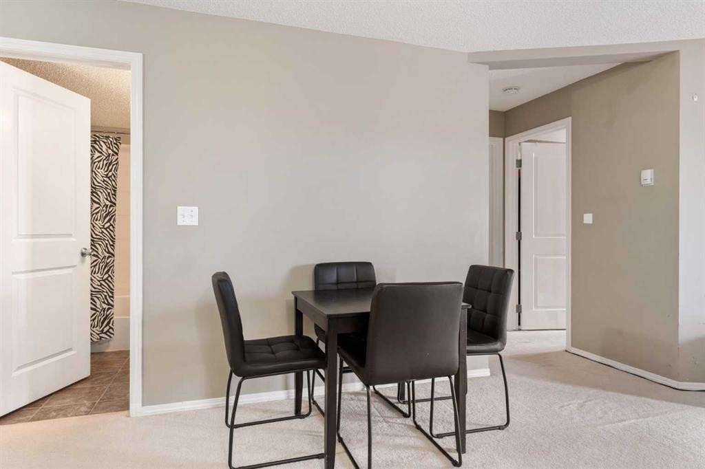 203-5 Saddlestone Way Ne, Calgary, AB - Indoor Photo Showing Dining Room